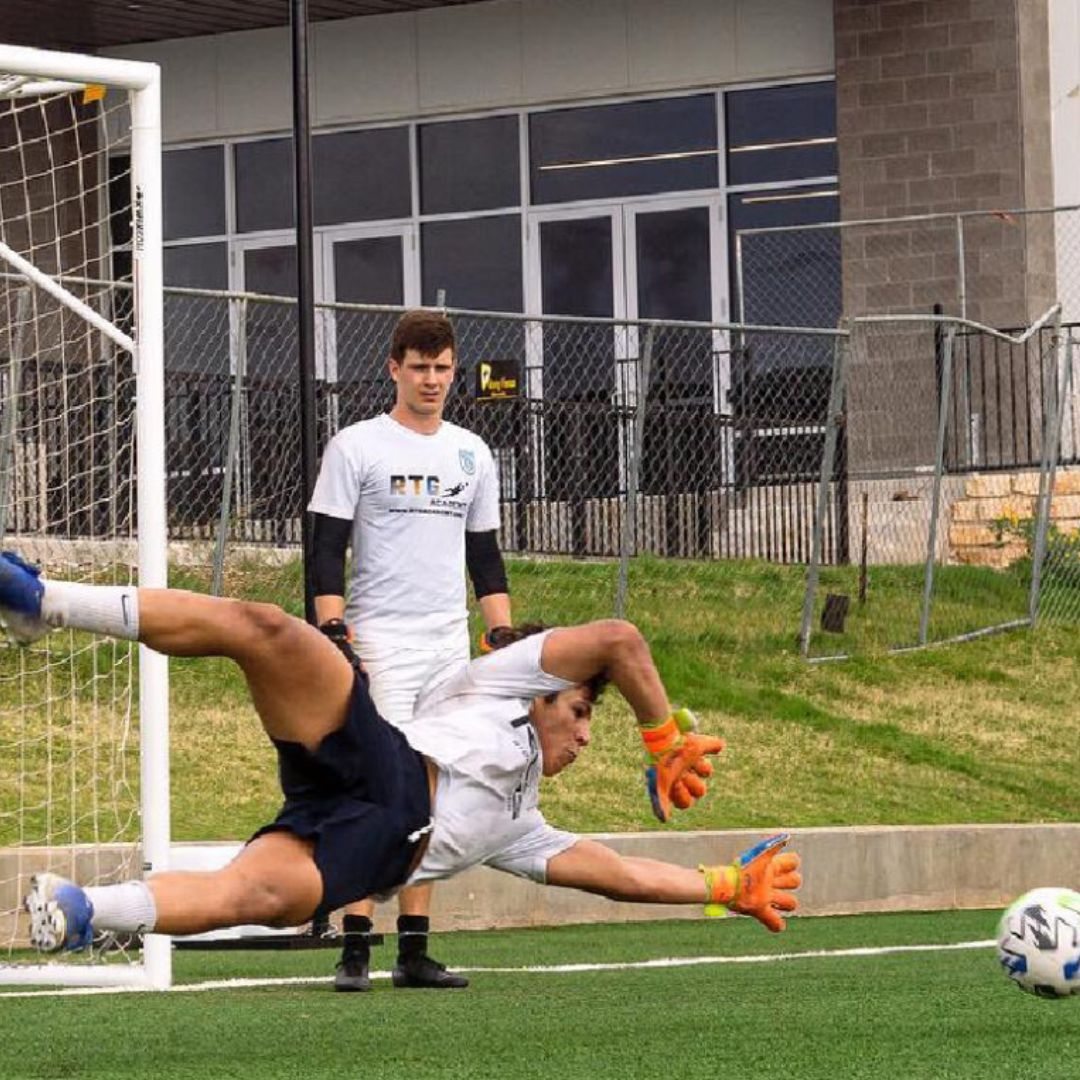 young goalie blocking a ball